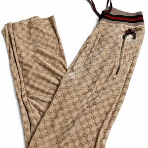 Gucci Beige Monogram Pants with Red and Green Accents